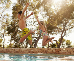 kids jumping in pool - family friendly ibiza