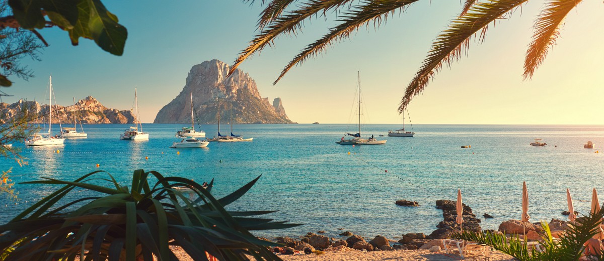 Cala d'Hort beach. Cala d'Hort in summer is extremely popular, beach have a fantastic view of the mysterious island of Es Vedra. Ibiza Island, Balearic Islands. Spain