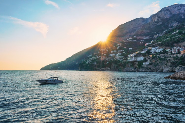 Sorrento & Amalfi Coast Sunset and Yacht at Amalfi town in Tyrrhenian sea in autumn, Amalfitana, Italy